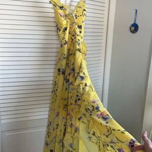 Long yellow flowered strap dress slit on the front